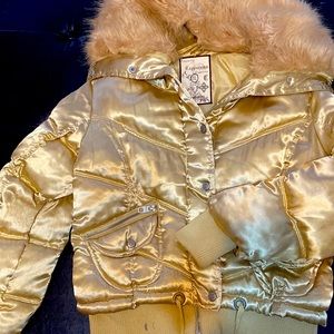 Gold puffer jacket with detachable faux collar.